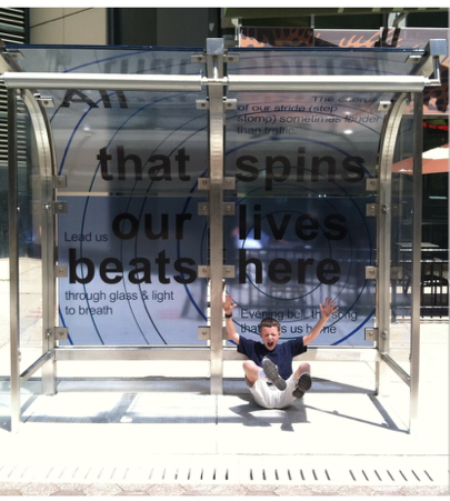 Image of person playing inside a newly redesigned bus station stop