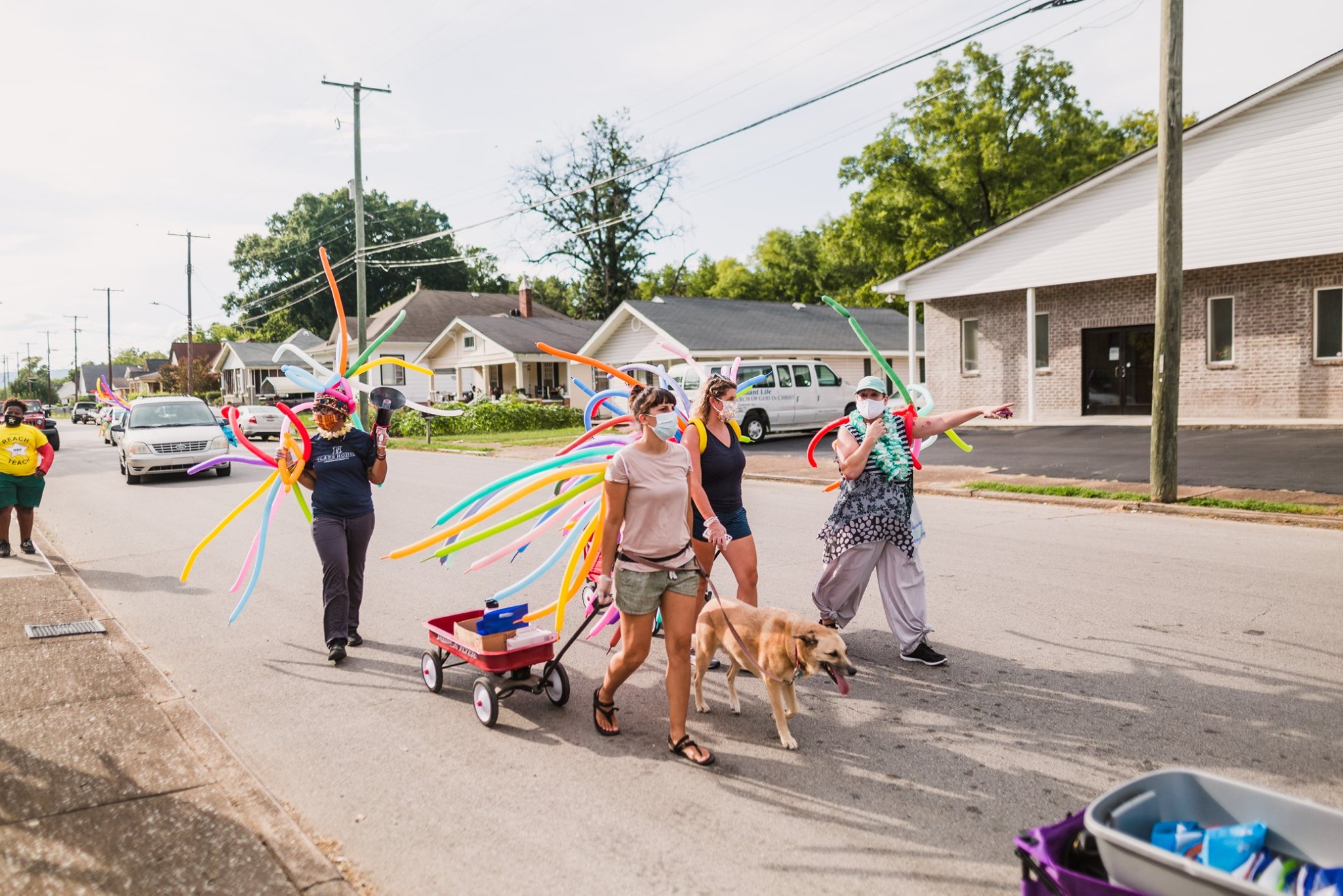 people walking down chattanooa street as part of rolling surprise